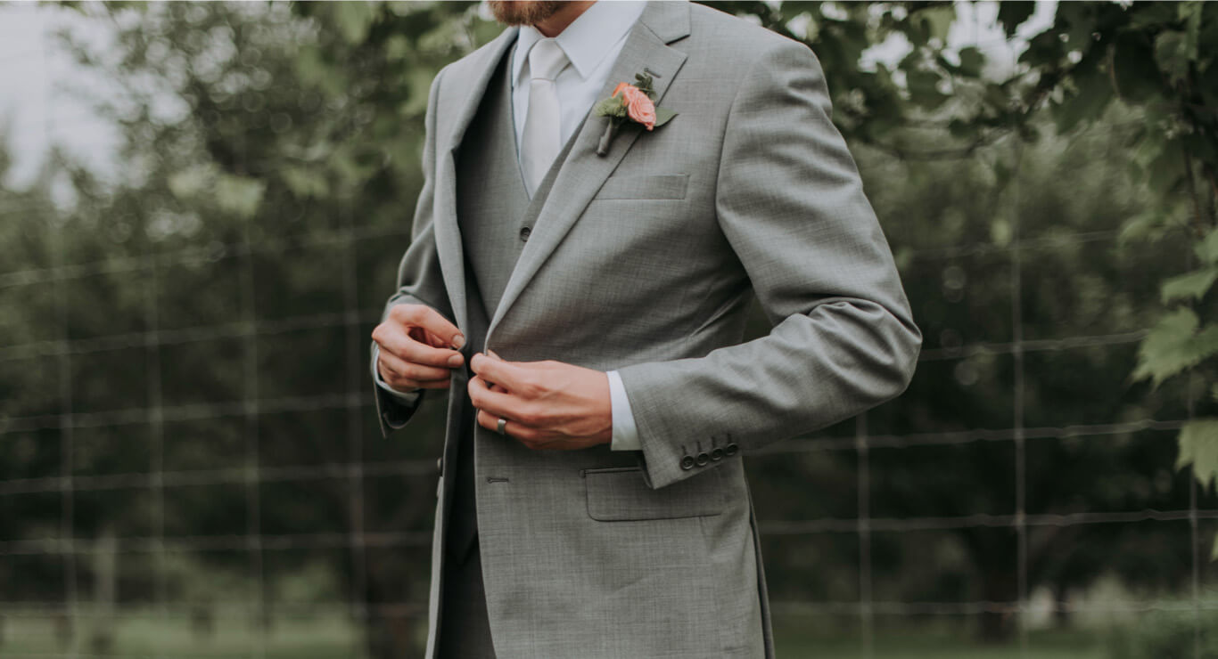 Photo of man in a gray suit