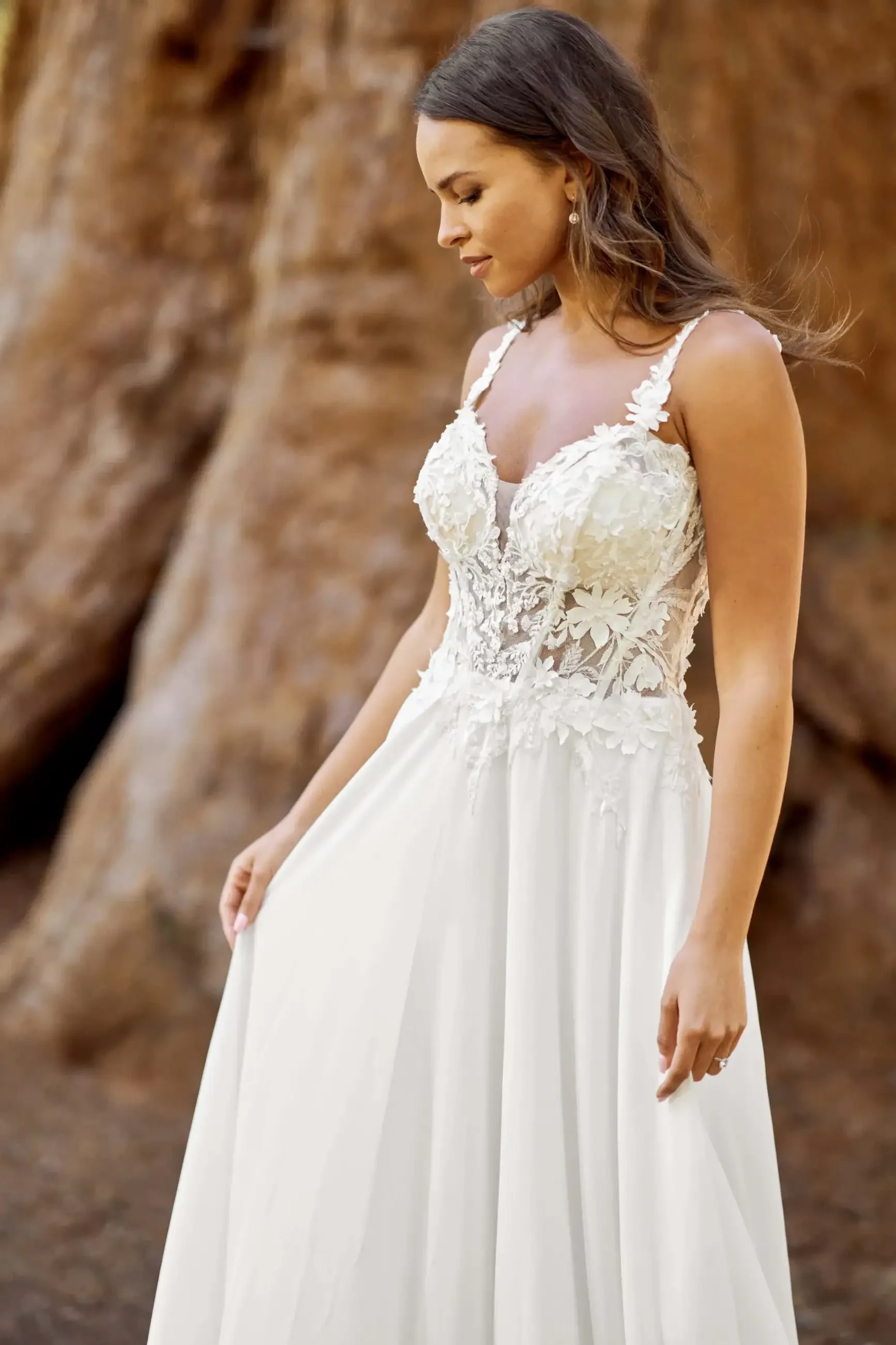 model is wearing a sleeveless a-line wedding dress