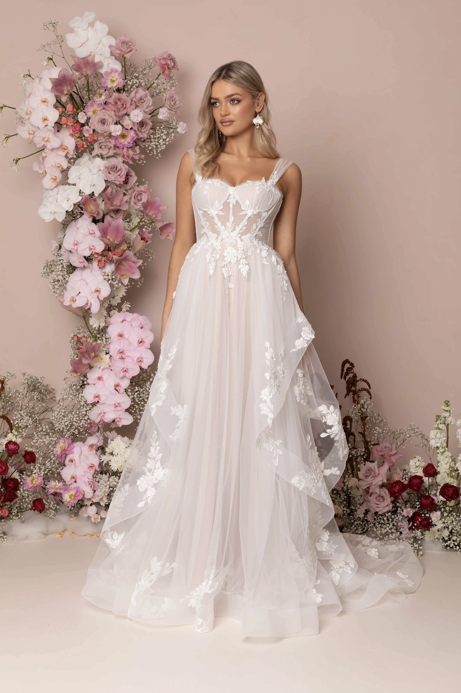 Model wearing Kelsey wedding dress by Madi Lane