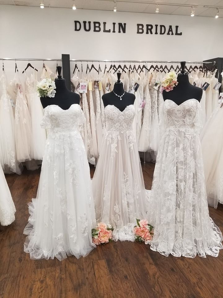 Three mannequins dressed in strapless wedding dresses inside Dublin Bridal shop
